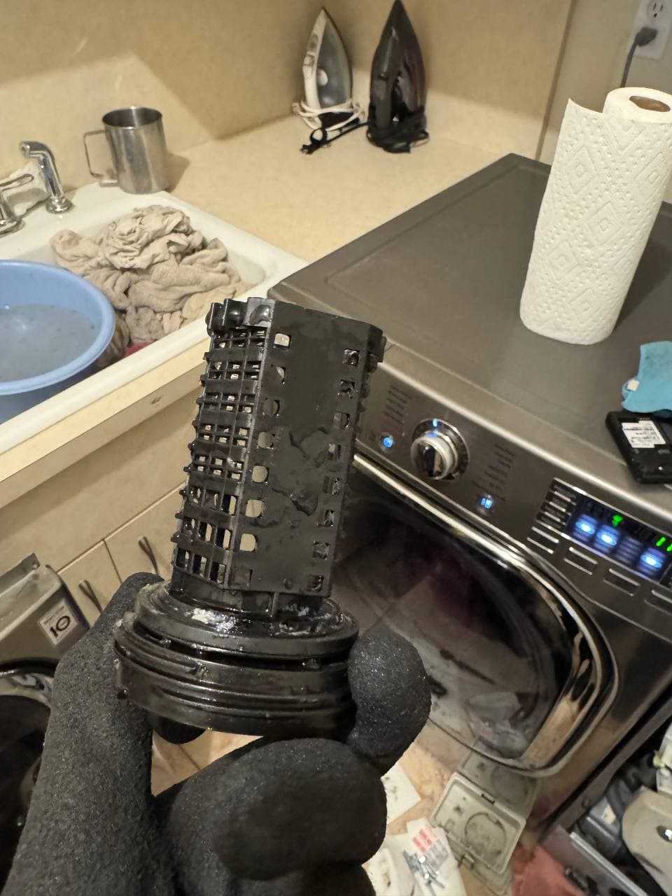 The same dryer lint trap housing fully cleaned after service
